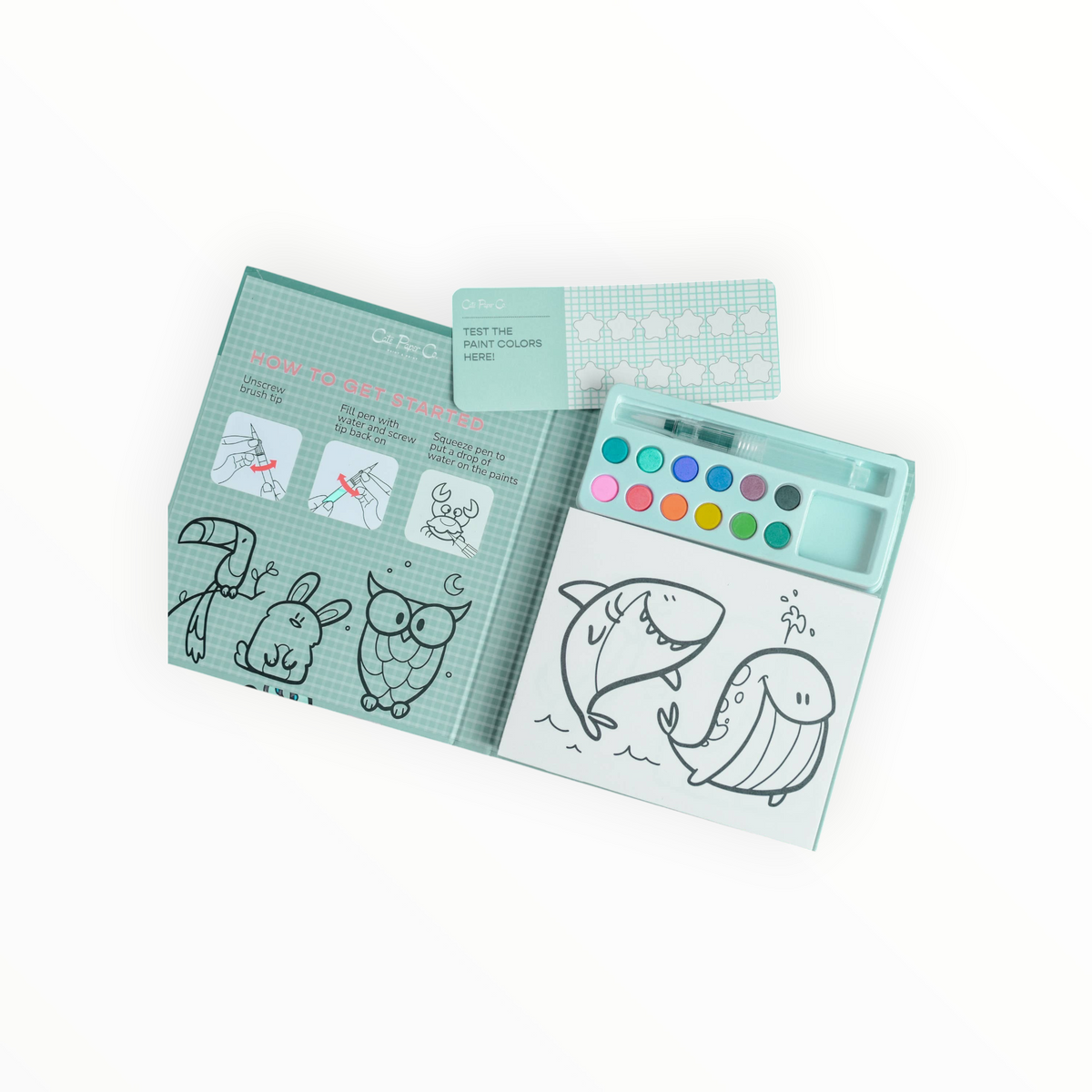 Cate Paper Co. Animal Kingdom Watercolor Painting Book open page with outline animals and paint palette