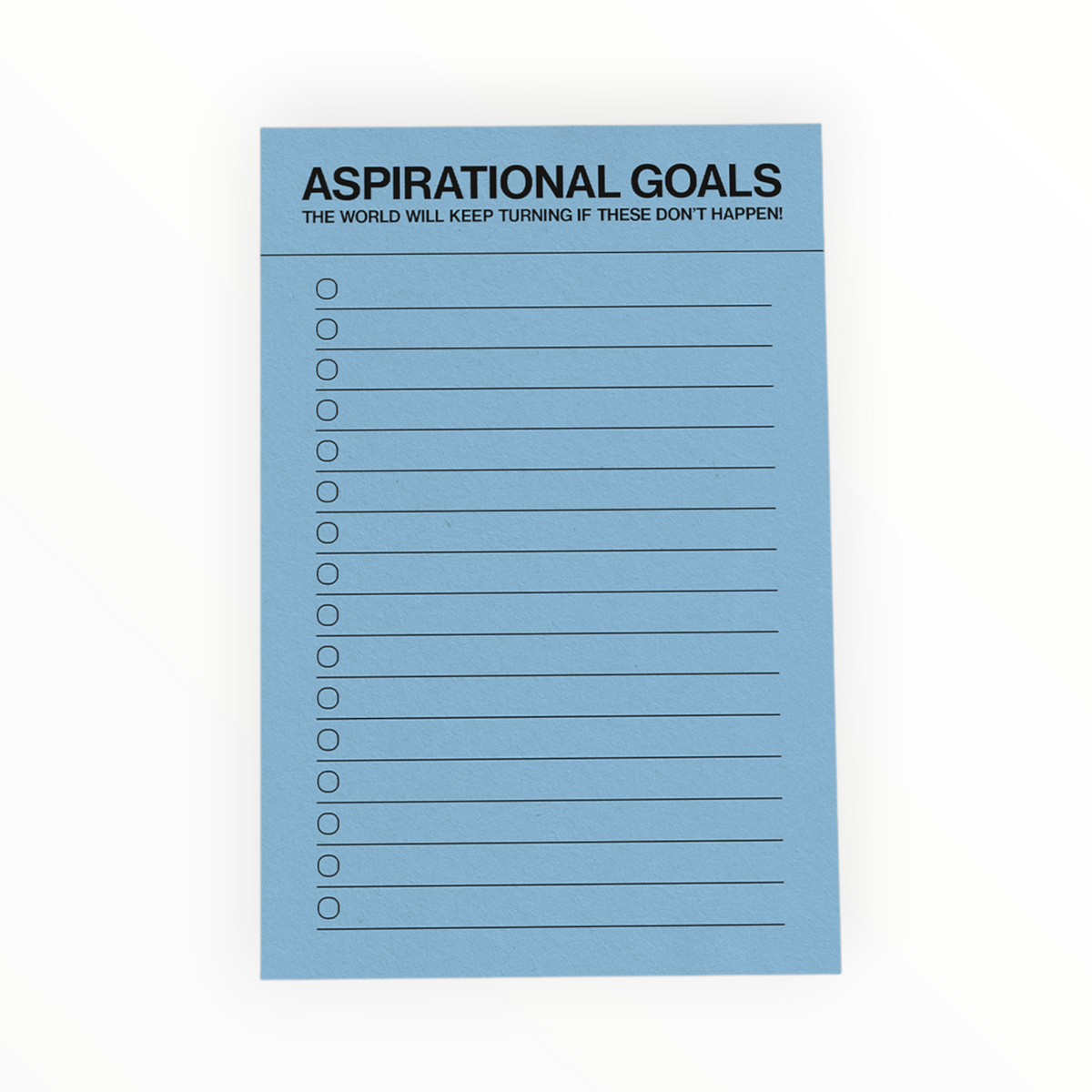 A light blue notepad with the text 'ASPIRATIONAL GOALS' and 'THE WORLD WILL KEEP TURNING IF THESE DON'T HAPPEN' at the top, followed by lined checkboxes below, shown on a white background.