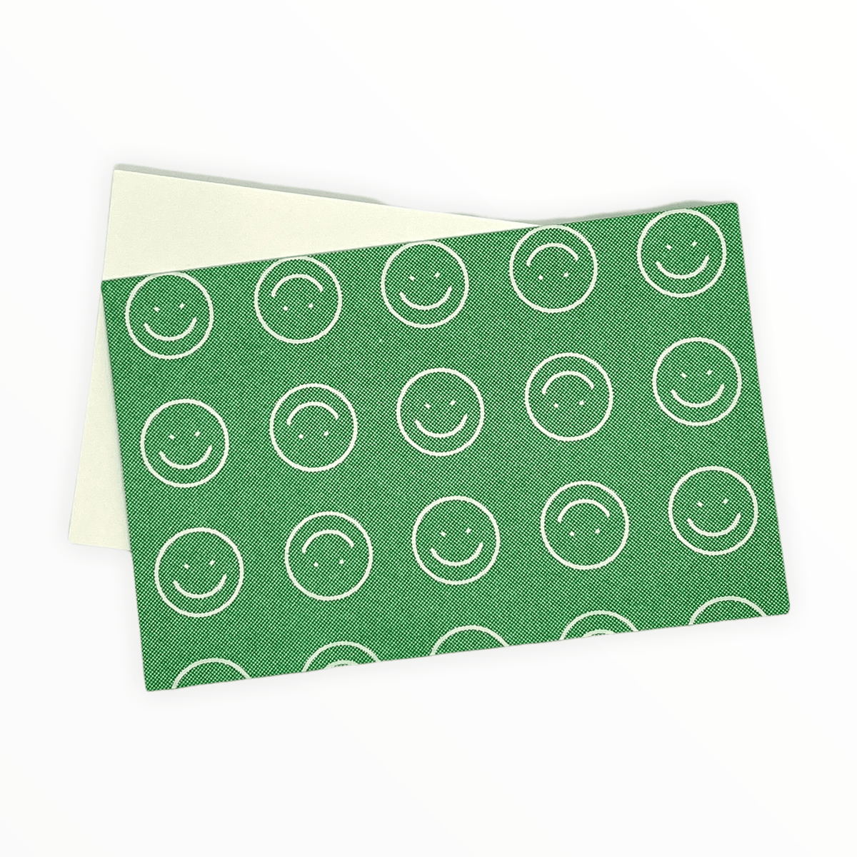 Green Smiley Envelopes with Blank Notecards detail by Poem Press, riso-printed smiley face envelope pattern