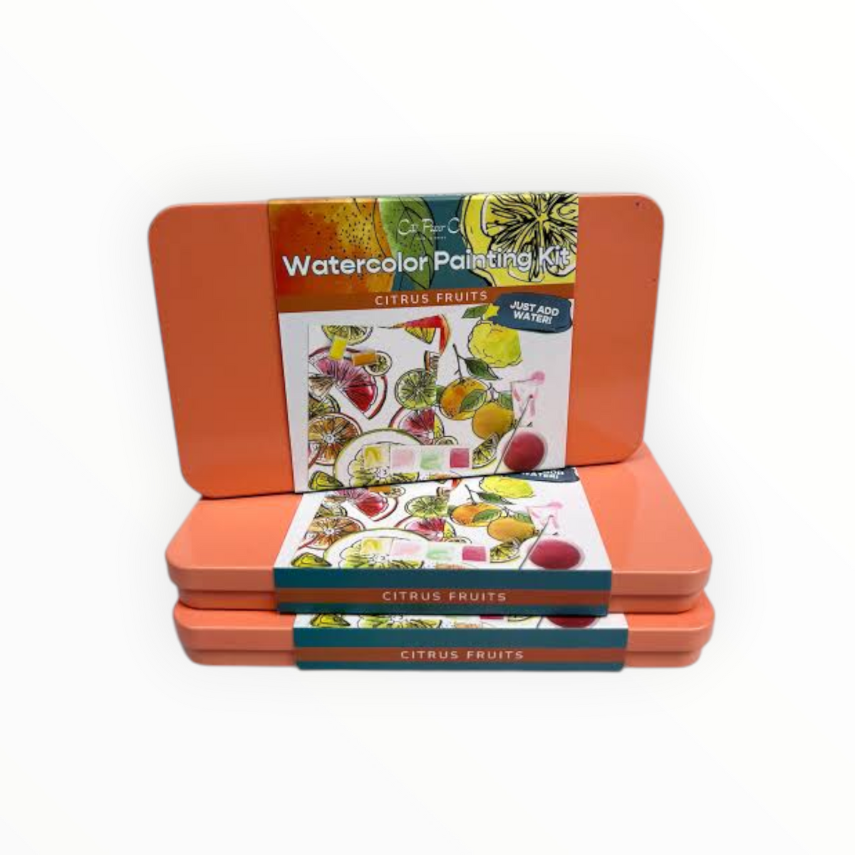 Three orange metal watercolor painting kits stacked on a white background, with the top kit open to show the citrus fruits watercolor painting book inside.