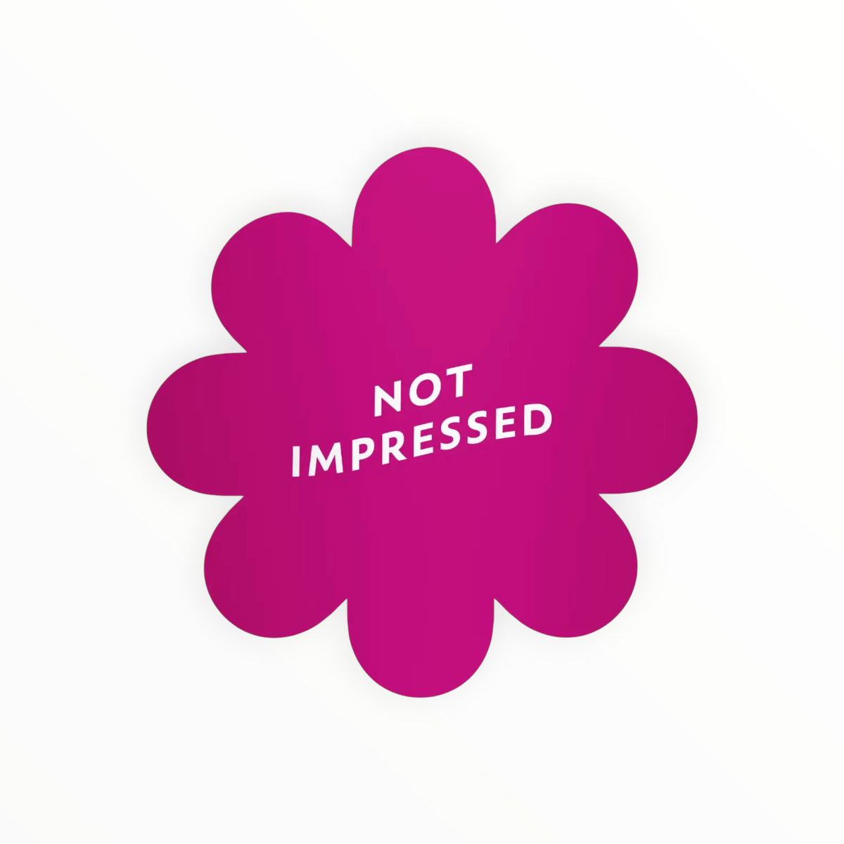 A bright magenta flower-shaped sticker or decal with the words 'NOT IMPRESSED' printed in white inside, shown on a plain white background.