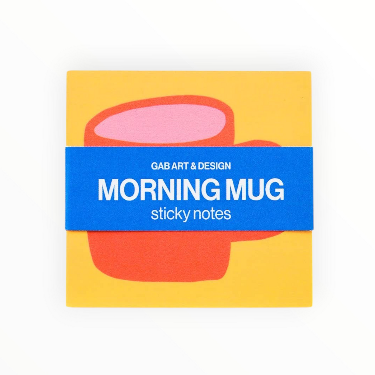 A square sticky note pad with a bright yellow background, a pink and orange abstract mug illustration, and a blue paper band across the center reading 'GAB ART & DESIGN MORNING MUG sticky notes'.