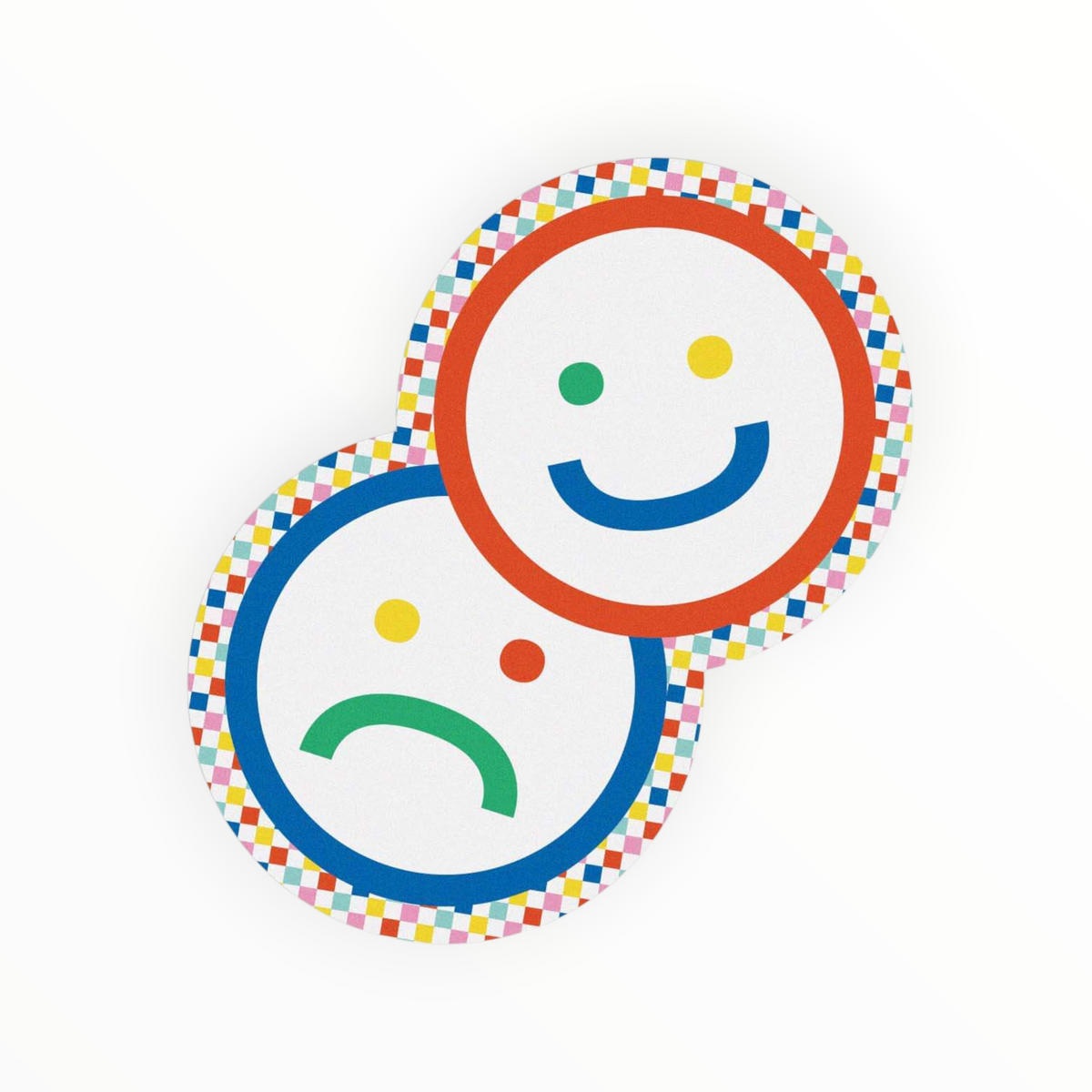 Two overlapping round stickers or badges on a white background, one with a smiling face and one with a sad face, both surrounded by a multicolor checkered border.
