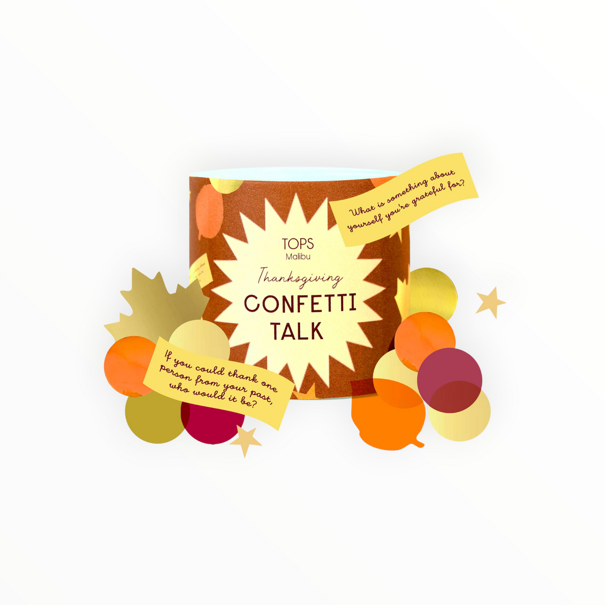 TOPS Malibu Thanksgiving Confetti Talk cylindrical canister with fall confetti and conversation starter cards scattered around it