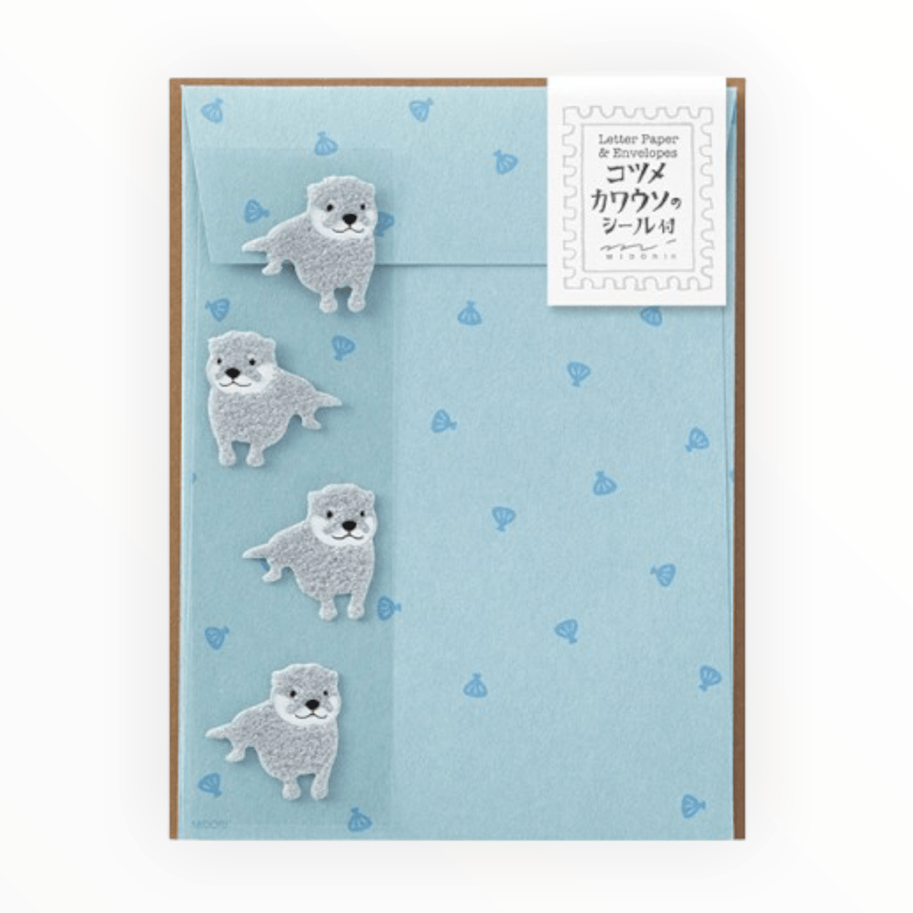 Otter Stationery Letterset by Midori, 12 sheets lined ivory paper with otter print, 4 envelopes, 4 fuzzy gray otter sealing stickers, 4.5 x 6 inches
