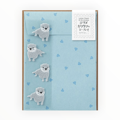 Otter Stationery Letterset by Midori, 12 sheets lined ivory paper with otter print, 4 envelopes, 4 fuzzy gray otter sealing stickers, 4.5 x 6 inches