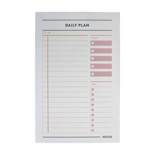Daily Plan Notepad by Recess Shop, 50 planning pages on off-white stock, date priorities and to-dos, 8.5 x 5.5 inches